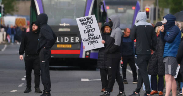 Northern Ireland Man Nearly Beheaded by Migrant Sparking Waves of Protests in U.K.